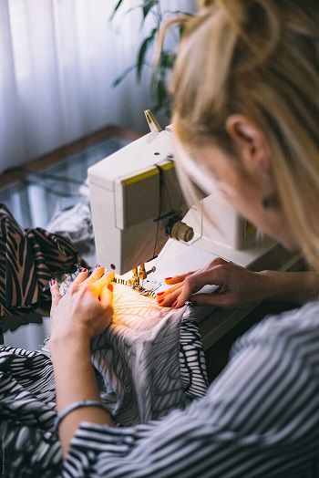 Woman Using Sewing Machine